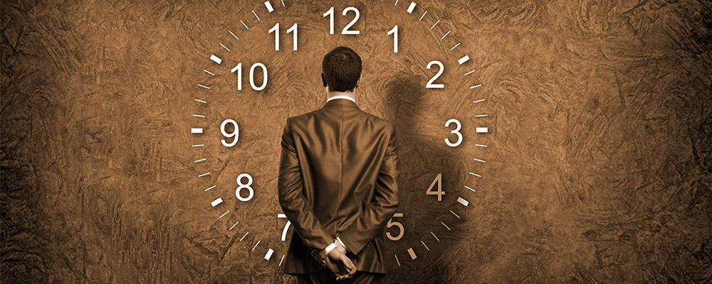 image of man facing armless clock